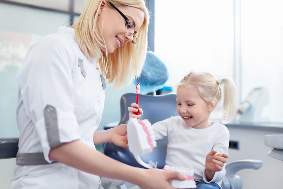 Dentist with a child in clinic